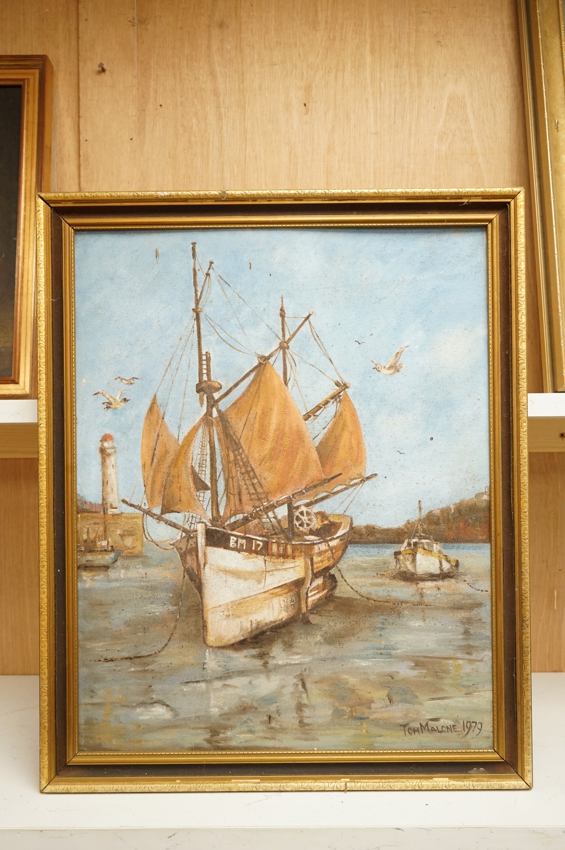 Tom Malone (1913-1986), Harbour view with beached fishing boat, signed and dated 1978, modern British oil on canvas board, 49 x 39cm